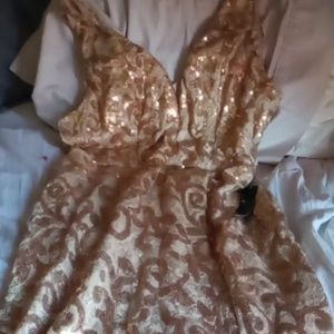 A dress the brand is Venus size 16 us gold